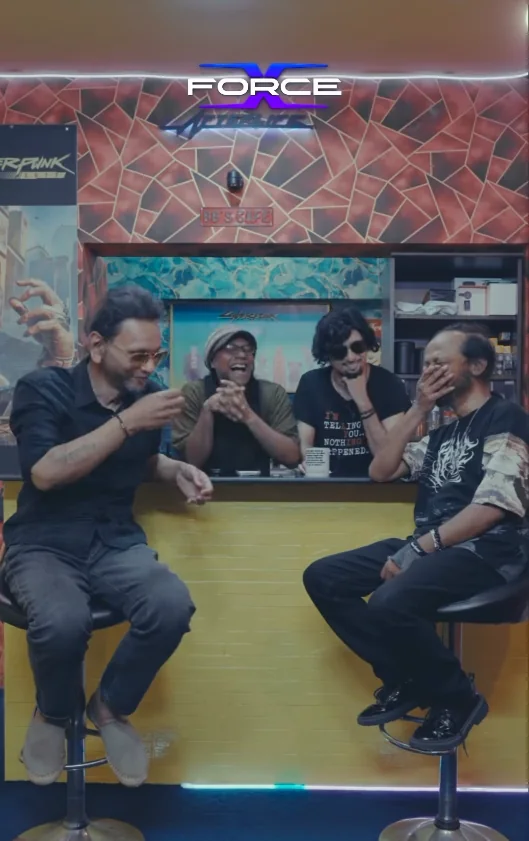 Four guests laughing around a bar counter on the X-Force Unlocked set